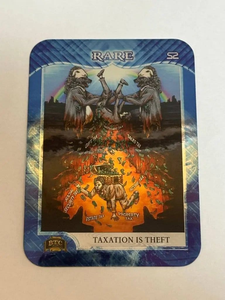 Close-up photograph of the 'Taxation is Theft' Rare Series 2 sticker, depicting two wolves in sheep's clothing shaking a man upside down, causing coins labeled with various taxes like 'Income Tax', 'Sales Tax', and 'Estate Tax' to fall into a fiery pit.