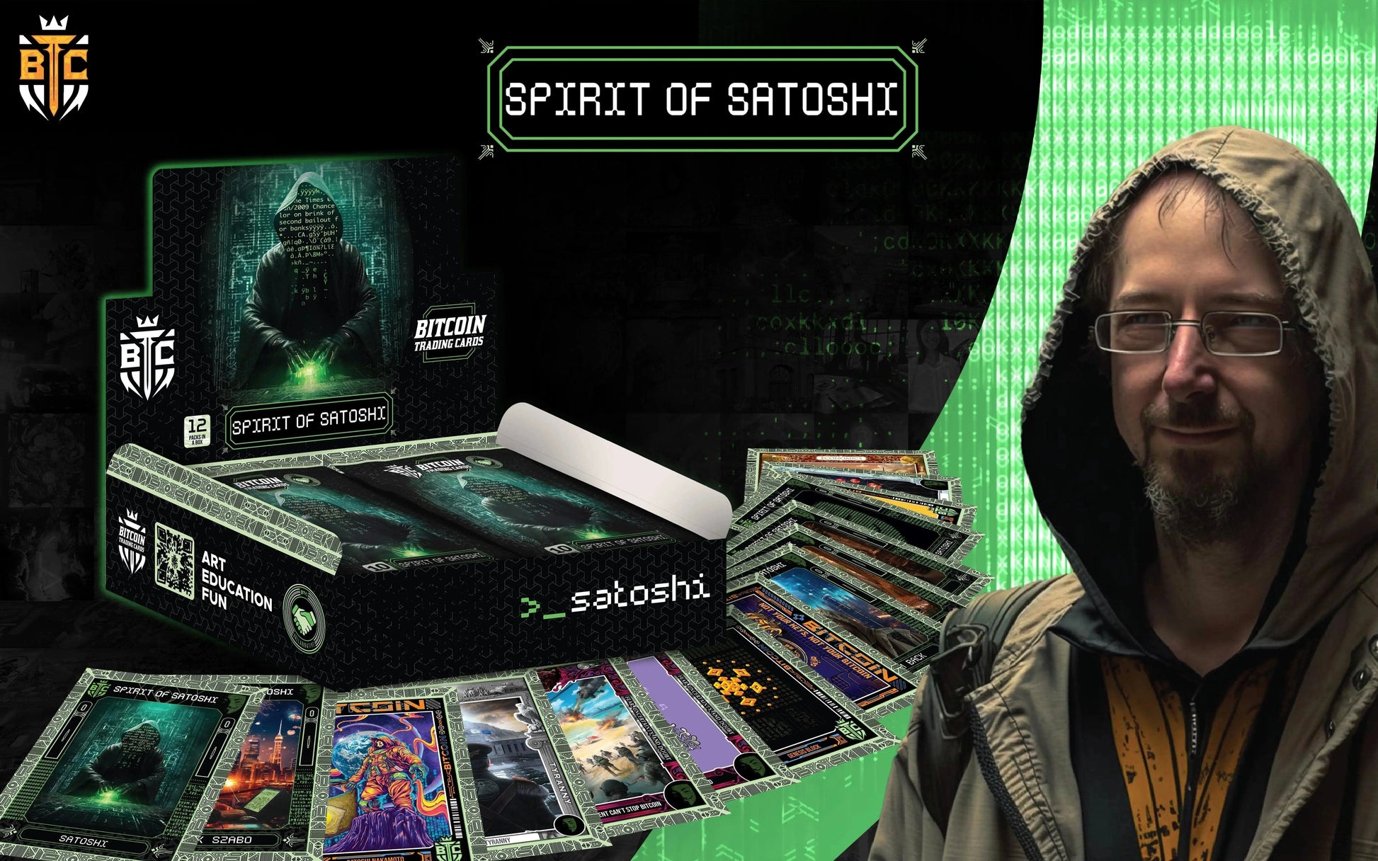 Adam Back wearing a hoodie displayed next to a Spirit of Satoshi Bitcoin Trading Cards hobby box with matrix code background.