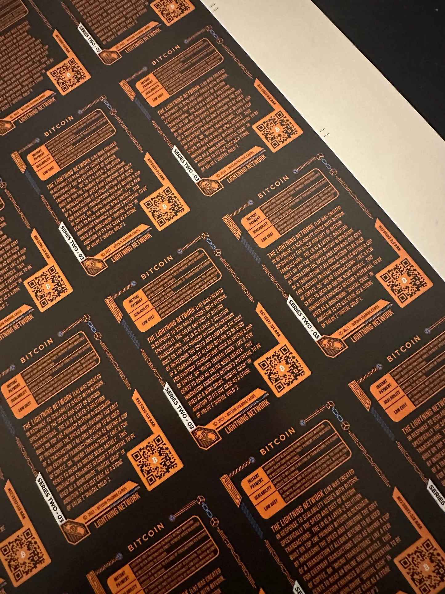 Close-up angled detail view of the educational text on the back of a Lightning Network Bitcoin Trading Card, explaining scalability and Layer 2 solutions.