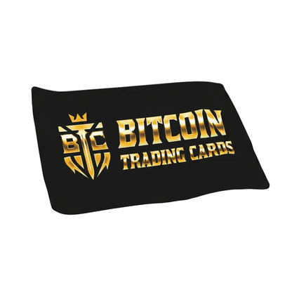 XL BTCTC Logo Breaker Mat with golden Based Trading Cards logo on black background