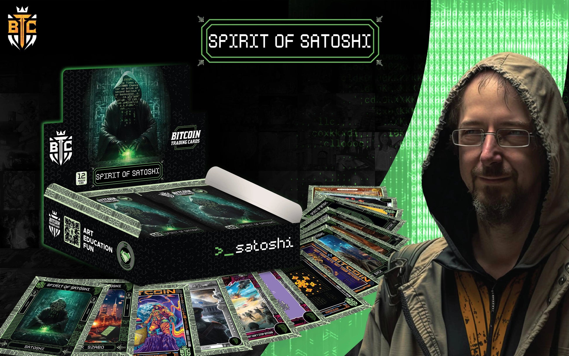 Promotional graphic for the 'Spirit of Satoshi' collection, featuring a large portrait of cryptographer Adam Back wearing a hoodie and glasses on the right, overlaid against the green Matrix code background and the open display box with fanned cards.