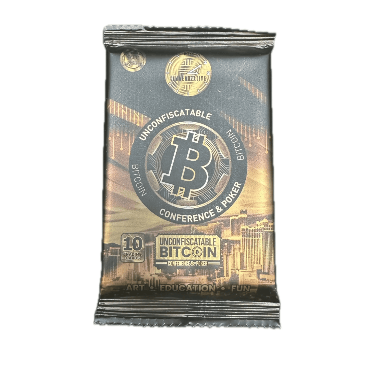 Studio photograph of the 'Unconfiscatable' Commemorative Collection foil pack, featuring a black and gold design with a large poker chip Bitcoin logo, a Las Vegas skyline background, and text reading 'Bitcoin Conference & Poker