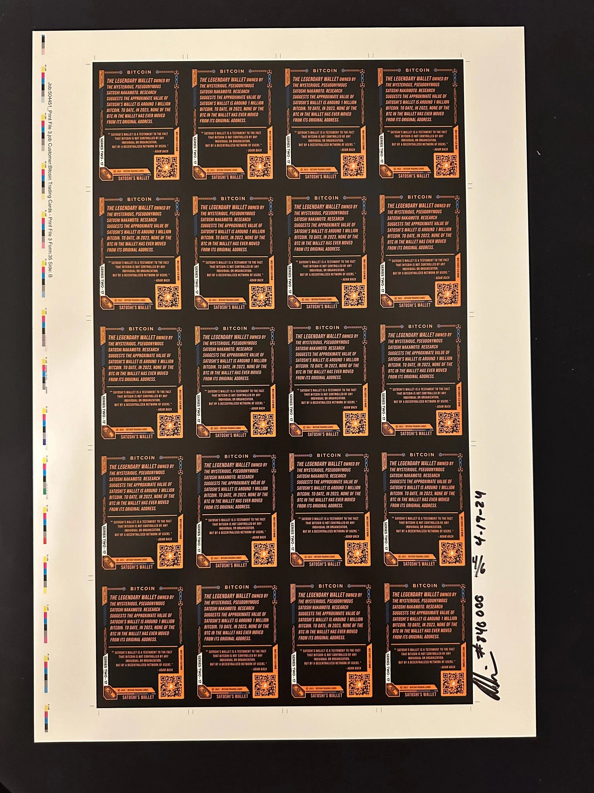 Back of an uncut production press sheet for Bitcoin Trading Cards displaying the text side of 'Satoshi's Wallet' cards with printer color bars and handwritten approval signatures.