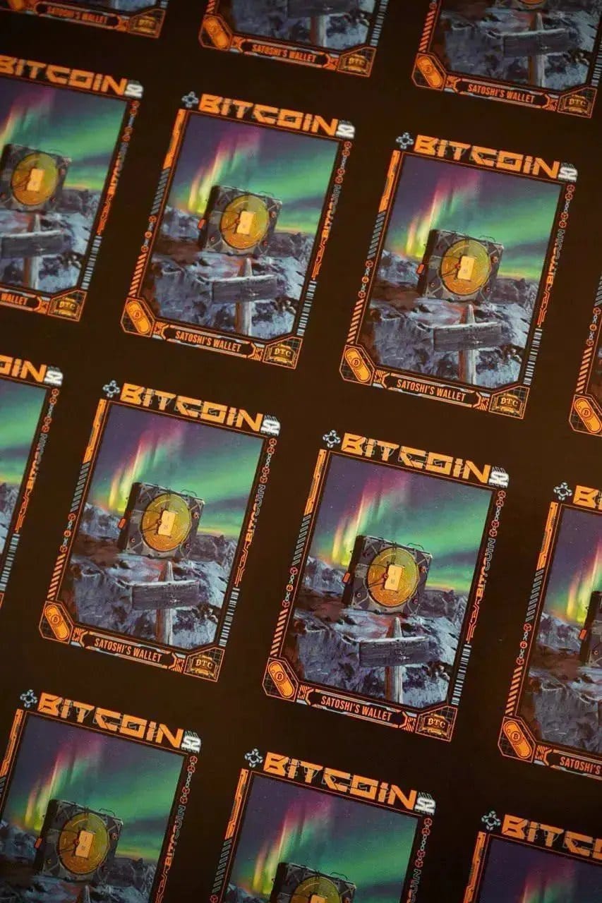 Uncut production press sheet of Bitcoin Trading Cards featuring a grid of the 'Satoshi's Wallet' card art, showing a Bitcoin cube in a snowy landscape under the aurora borealis.